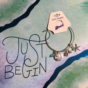 ** 3/$21 **  Cape charms bracelet silver tone